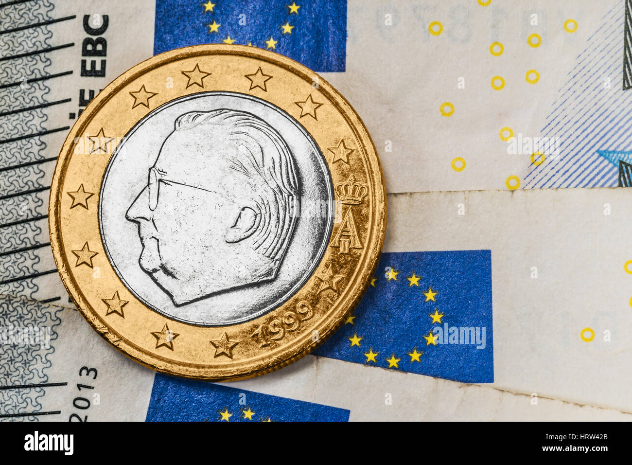 a 1 euro coin from Belgium on euro banknotes Stock Photo