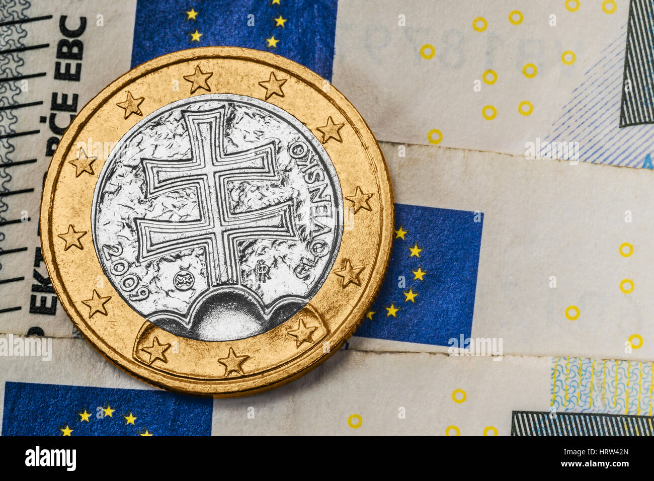 a 1 euro coin from Slovakia on euro banknotes Stock Photo