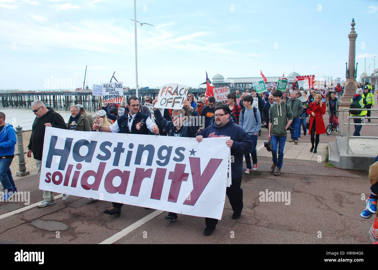 People take part in an Anti Austerity march at Hastings in East Sussex, England on May 30, 2015. Stock Photo