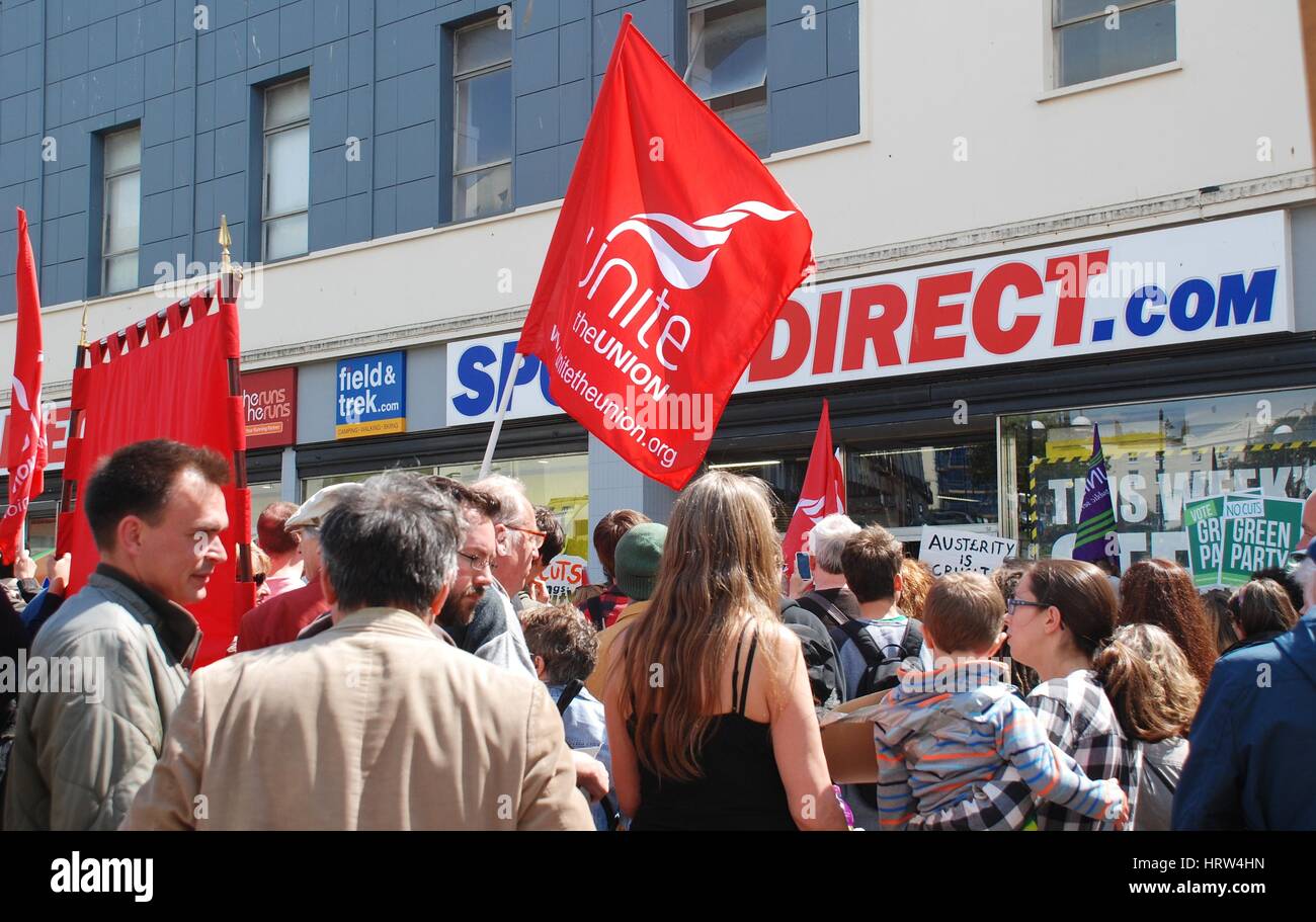 People protest against zero hour contracts outside a branch of Sports Direct following an anti austerity march at Hastings, England on May 30, 2015. Stock Photo