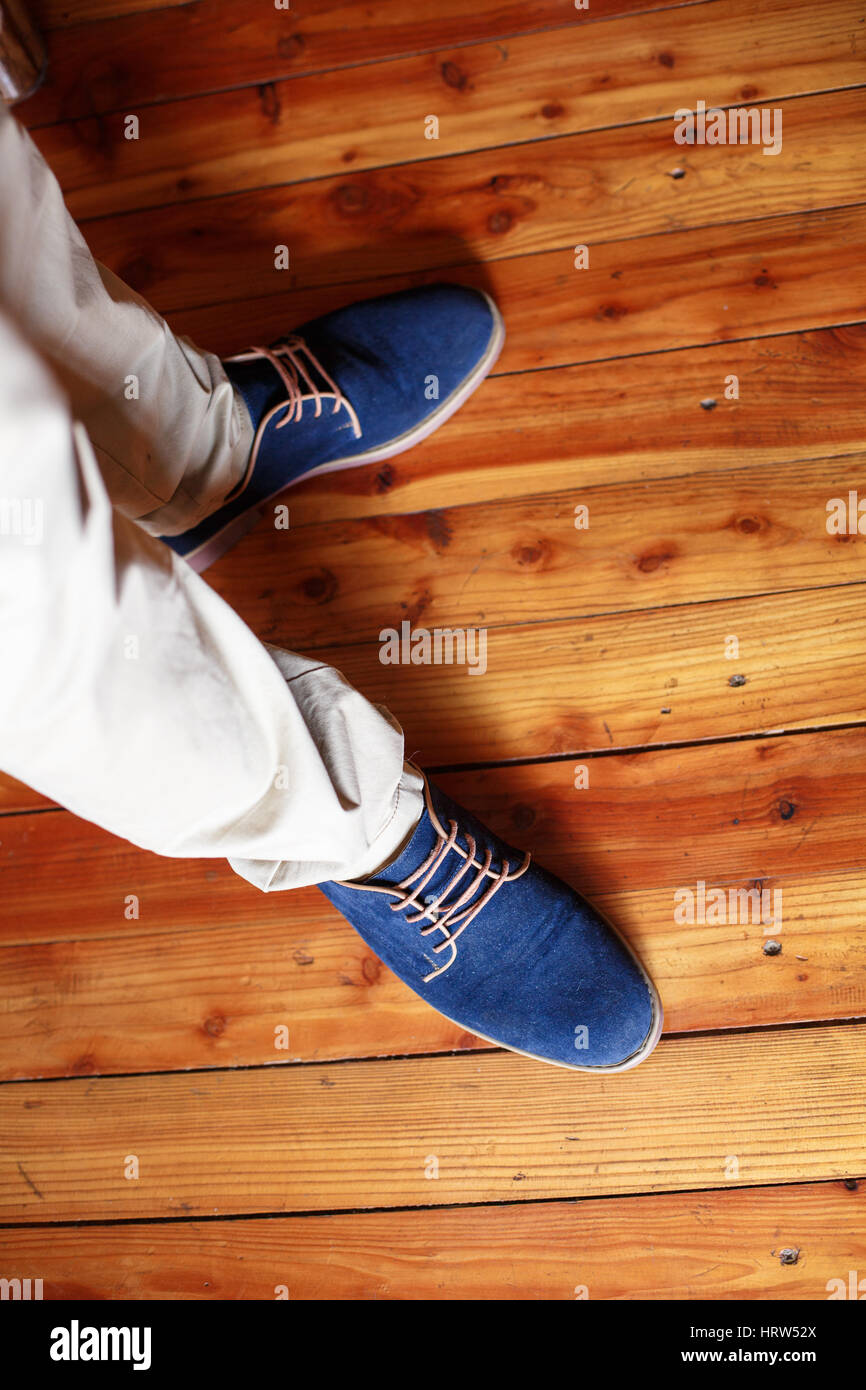 blue suede shoes on a man who is preparing for wedding Stock Photo