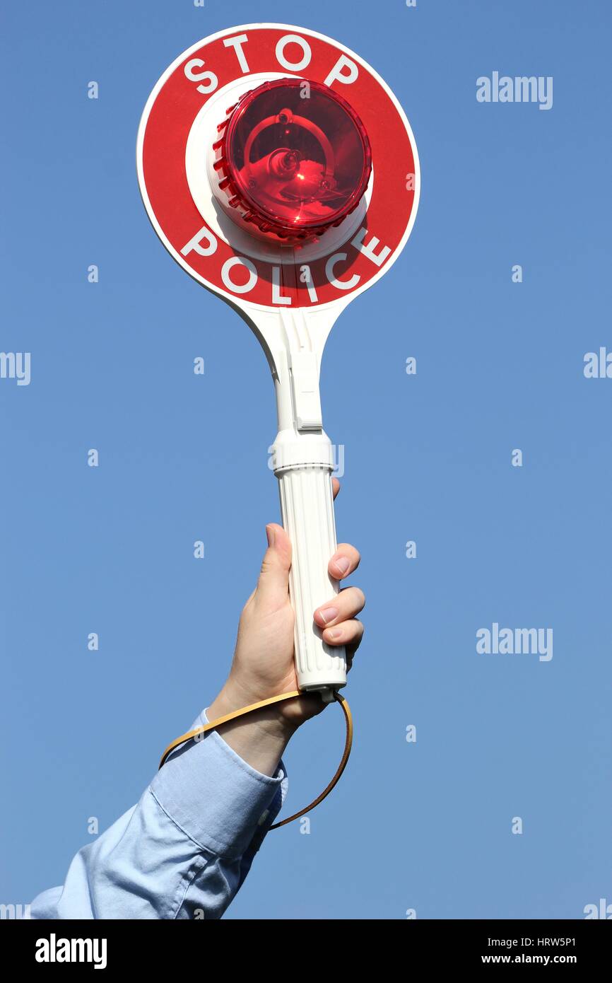 police signalling disc against blue sky Stock Photo
