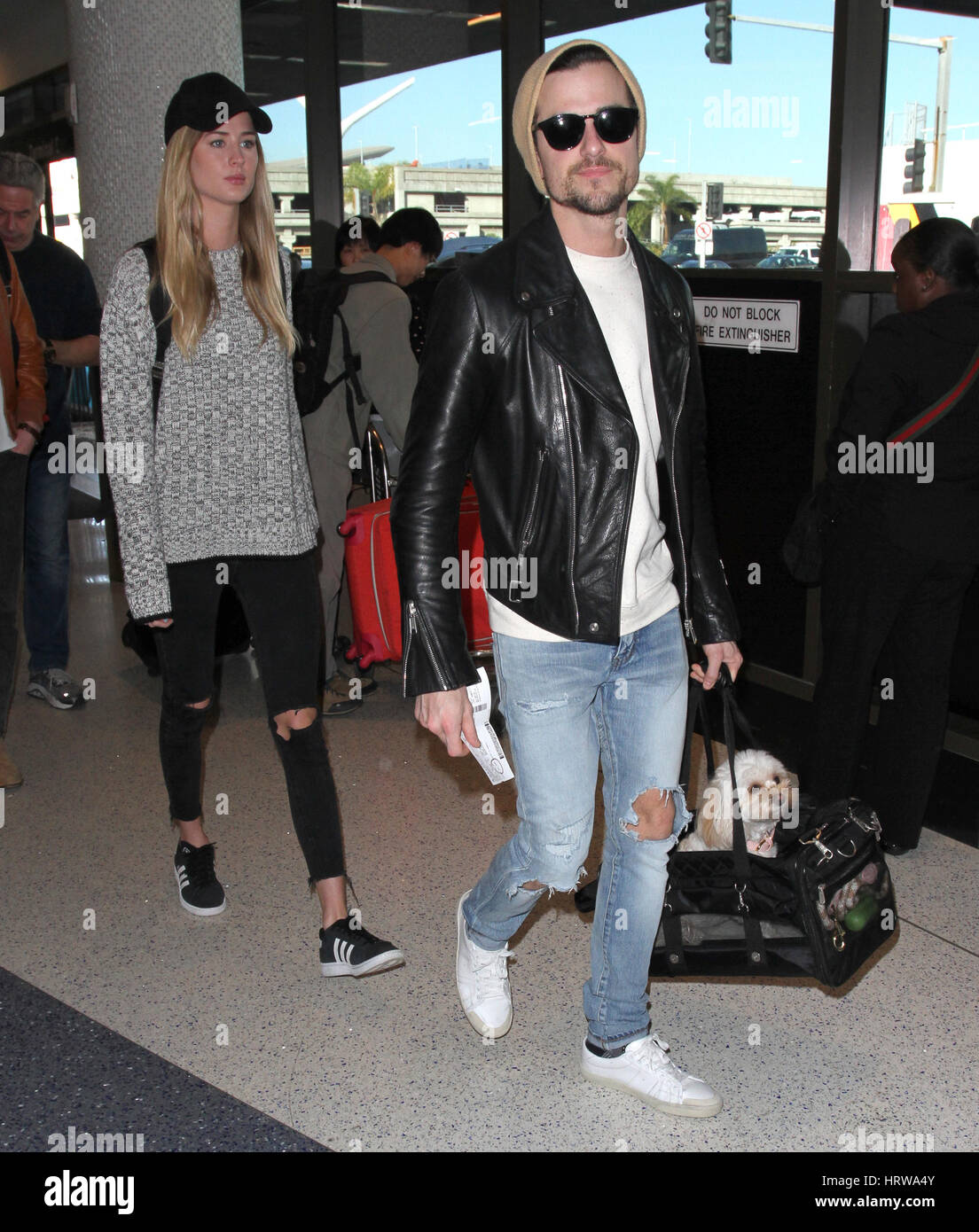 Kings of Leon brothers Caleb Followill and Jared Followill arrive at Los Angeles International (LAX) Airport  Featuring: Jared Followill, Martha Patterson Where: Los Angeles, California, United States When: 31 Jan 2017 Stock Photo