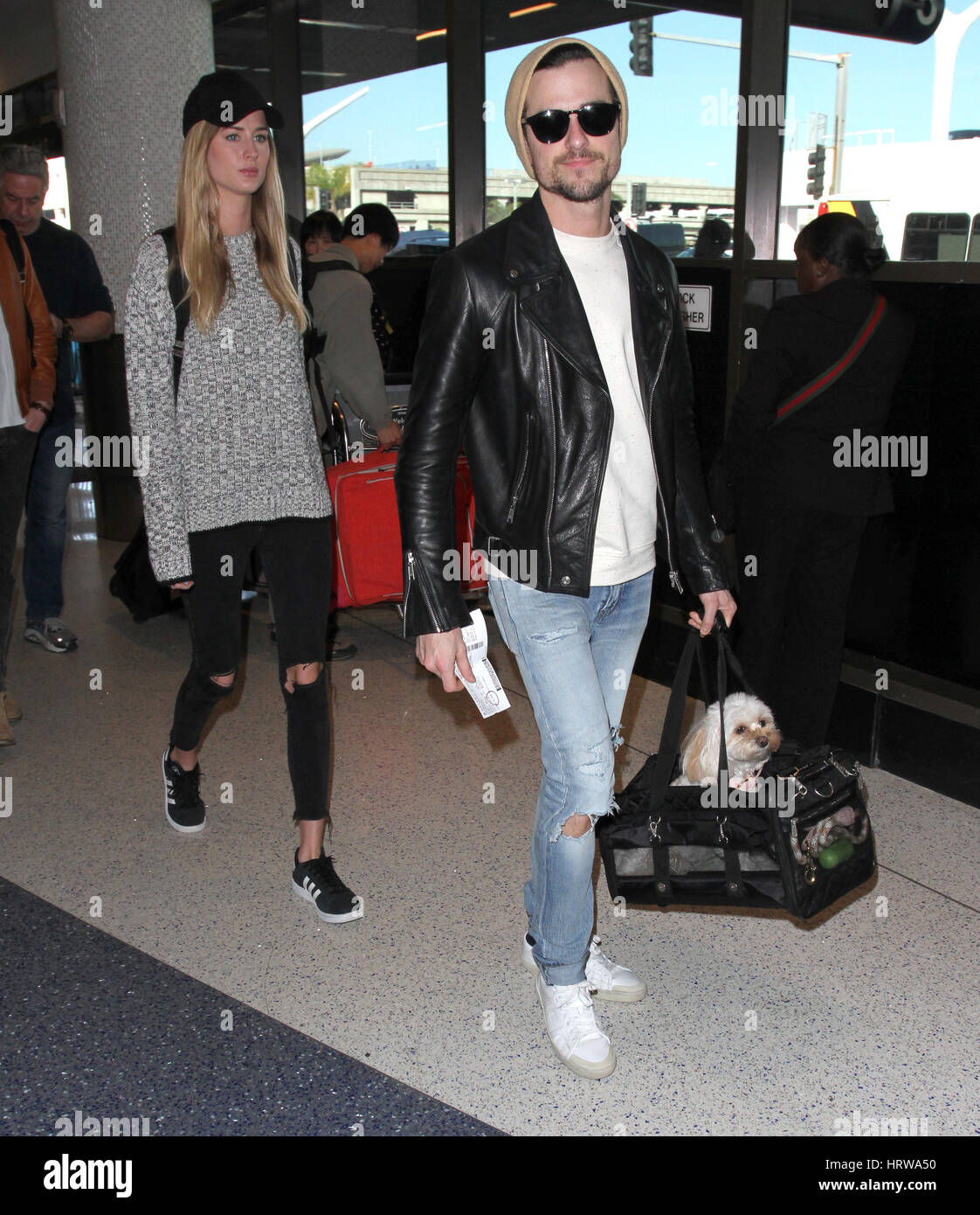 Kings of Leon brothers Caleb Followill and Jared Followill arrive at Los Angeles International (LAX) Airport  Featuring: Jared Followill, Martha Patterson Where: Los Angeles, California, United States When: 31 Jan 2017 Stock Photo