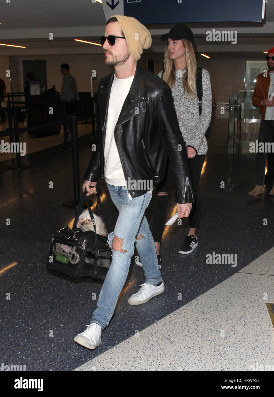 Kings of Leon brothers Caleb Followill and Jared Followill arrive at Los Angeles International (LAX) Airport  Featuring: Jared Followill, Martha Patterson Where: Los Angeles, California, United States When: 31 Jan 2017 Stock Photo