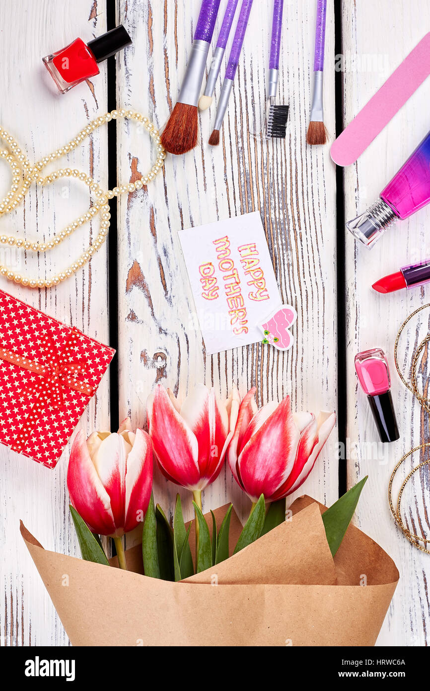 Flowers and gift box. Celebrate Mother's day. Stock Photo