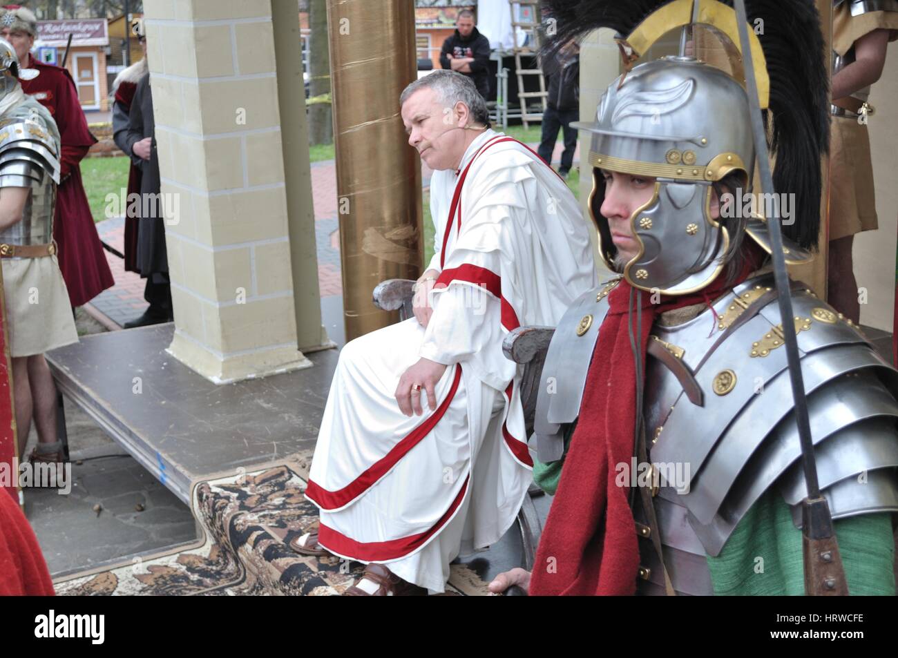 Actors reenact Pilate and security guard, during the street performances Mystery of the Passion. Stock Photo