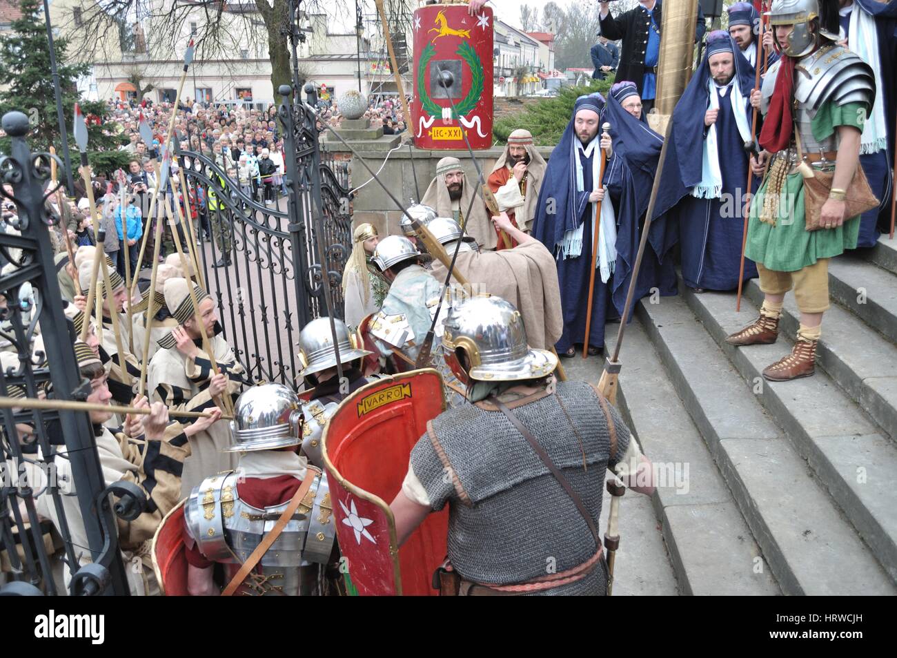 Actors reenact guards defending the entrance to Pilate, during the street performances Mystery of the Passion. Stock Photo