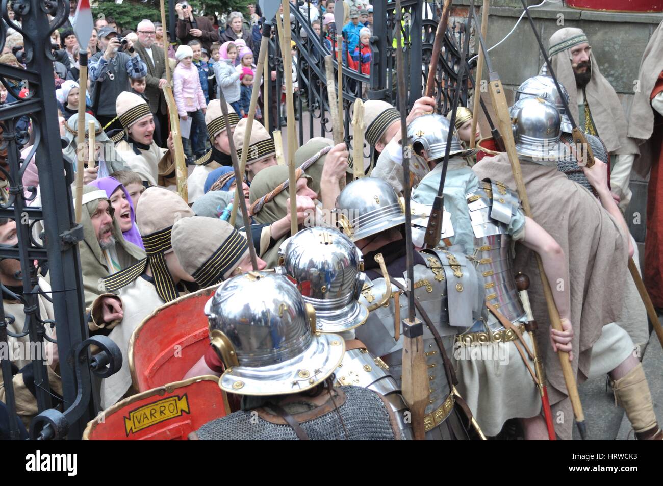 Actors reenact guards defending the entrance to Pilate, during the street performances Mystery of the Passion. Stock Photo