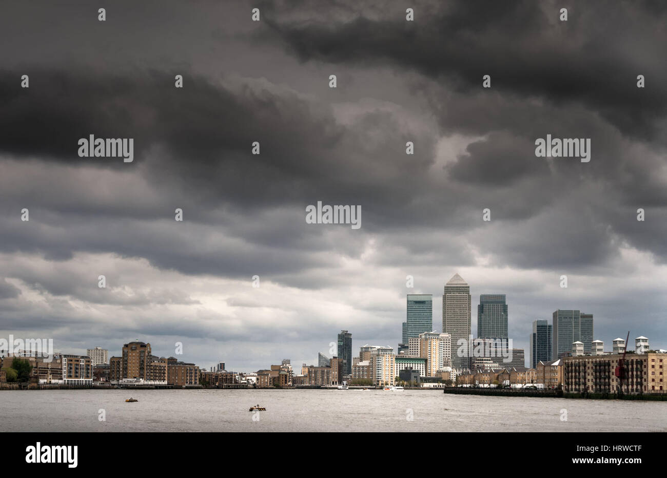 Grey clouds over financial district. Canary Wharf, London Stock Photo