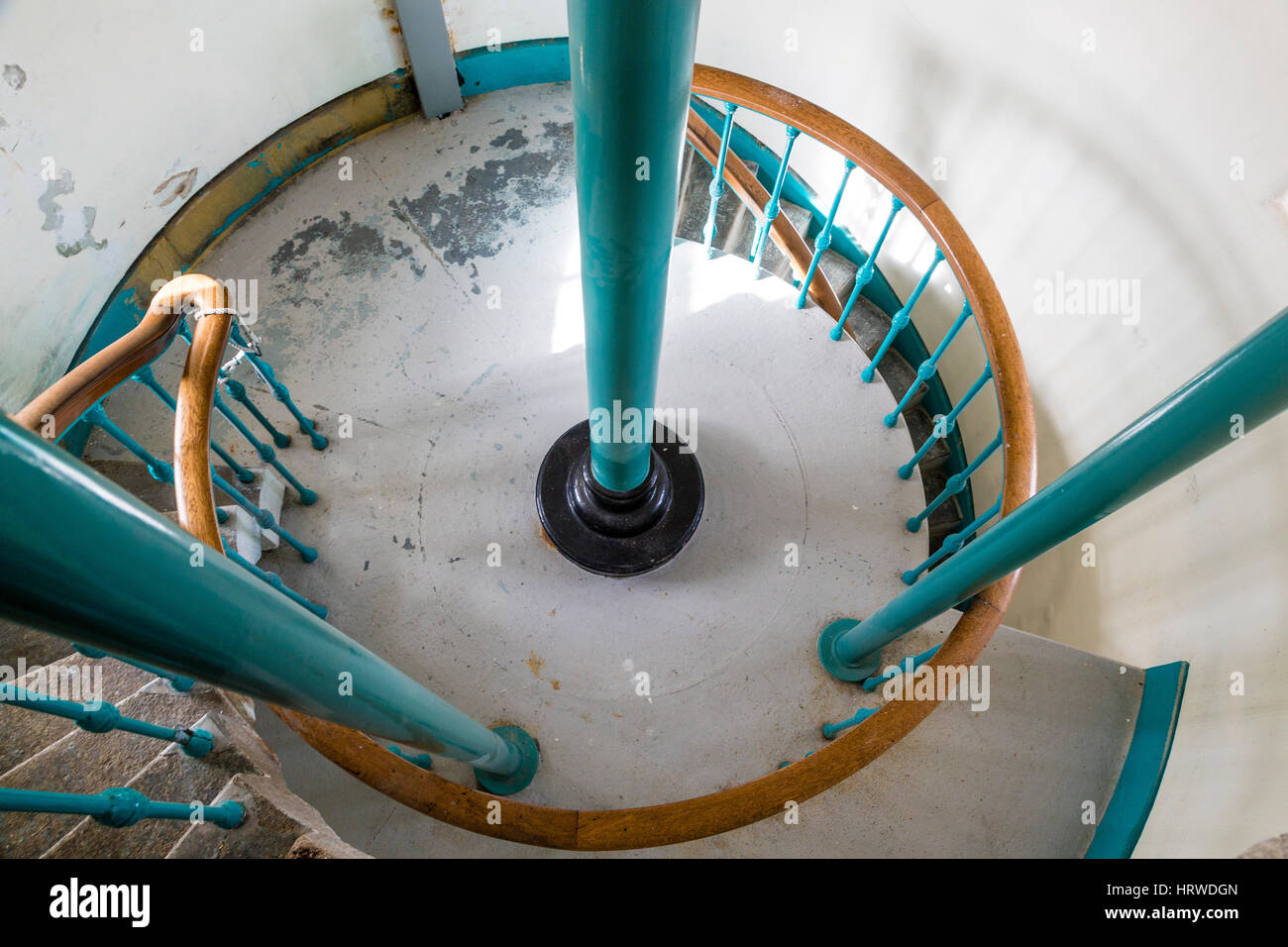 Spiral staircase with poles for gearing mechanism for lamp. Valentia Island lighthouse, County Kerry Ireland Stock Photo