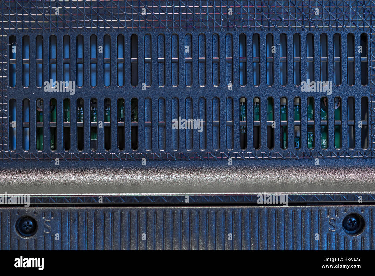 TV Rear view up close. Grating plastic cover on the back of the monitor