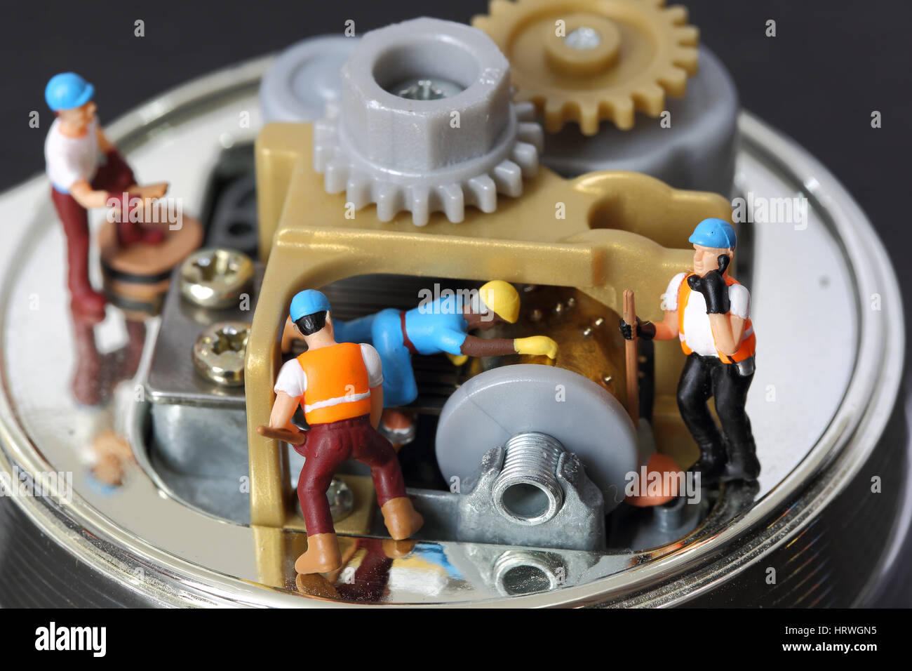 Selective focus of miniature engineer and worker fixed and repair musical box and use for business background. Stock Photo