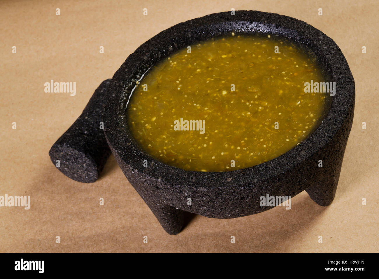 Stock image of mexican salsa verde on mortar and pestle Stock Photo