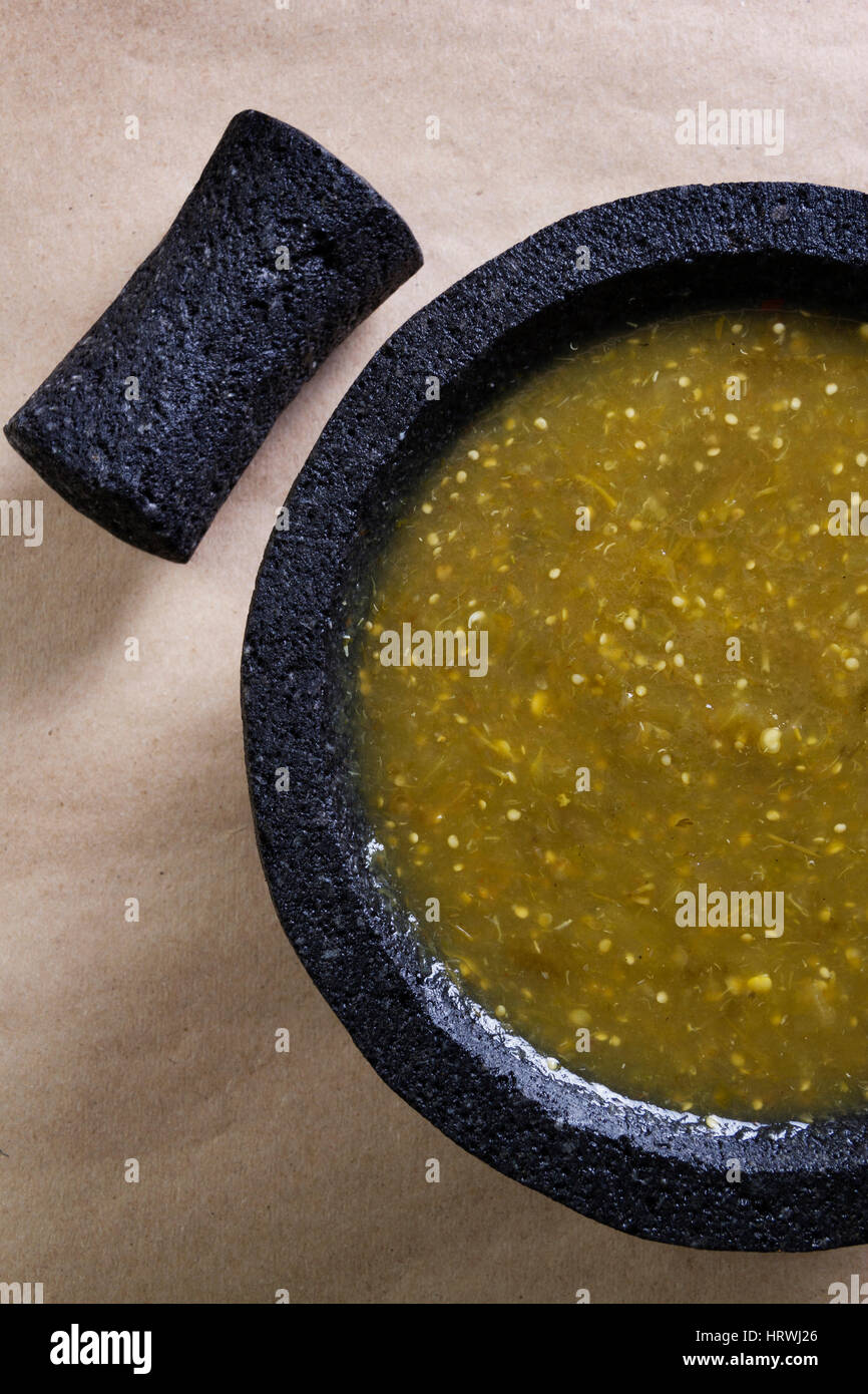 Stock image of mexican salsa verde on mortar and pestle Stock Photo