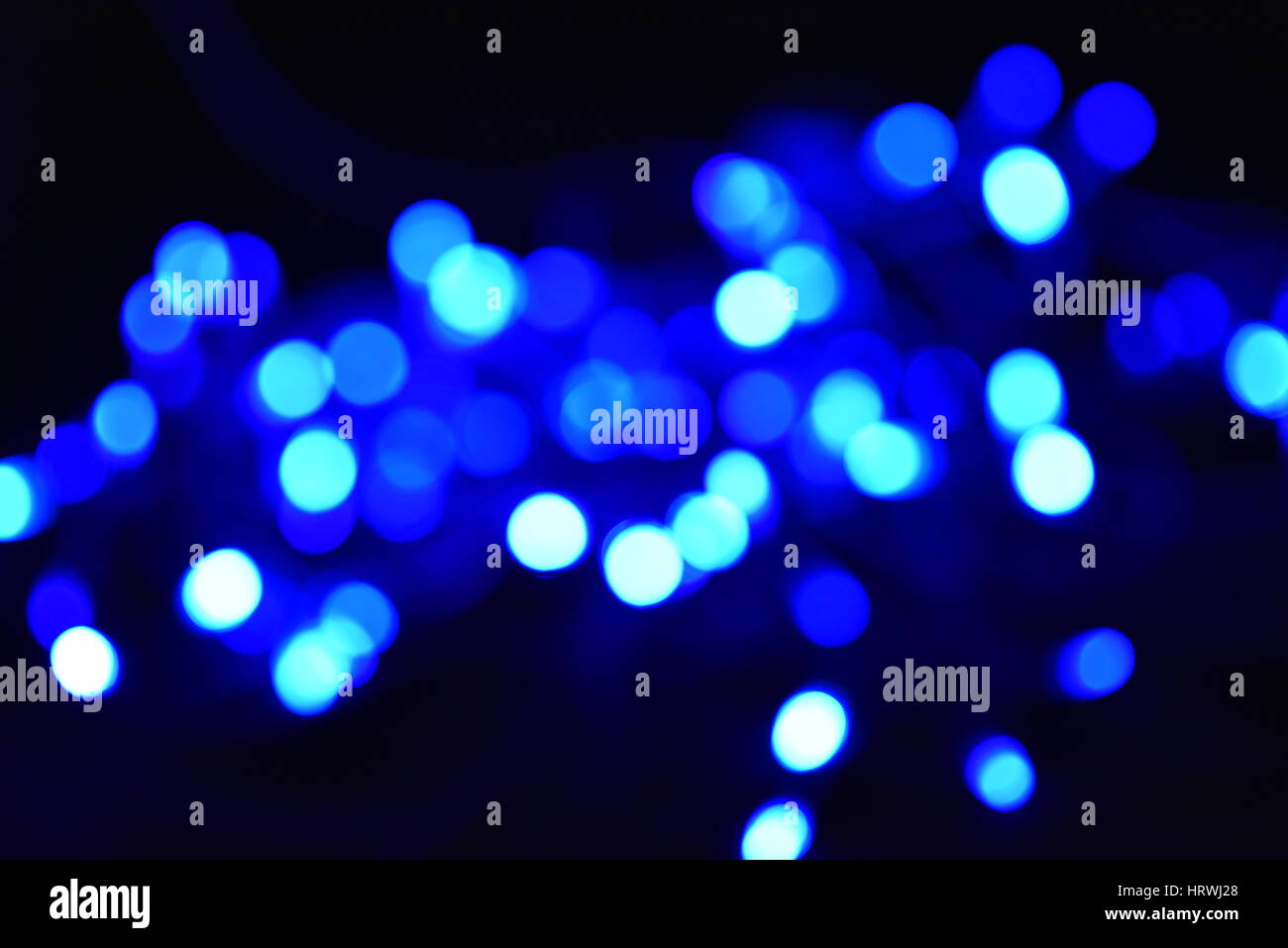 Blue and white blurred bokeh lights background. Stock Photo