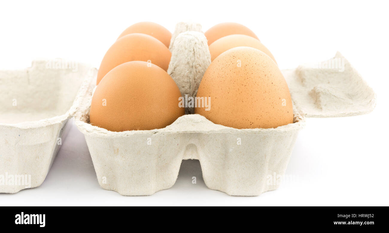 Brown chicken eggs in an open cardboard  carton. Stock Photo