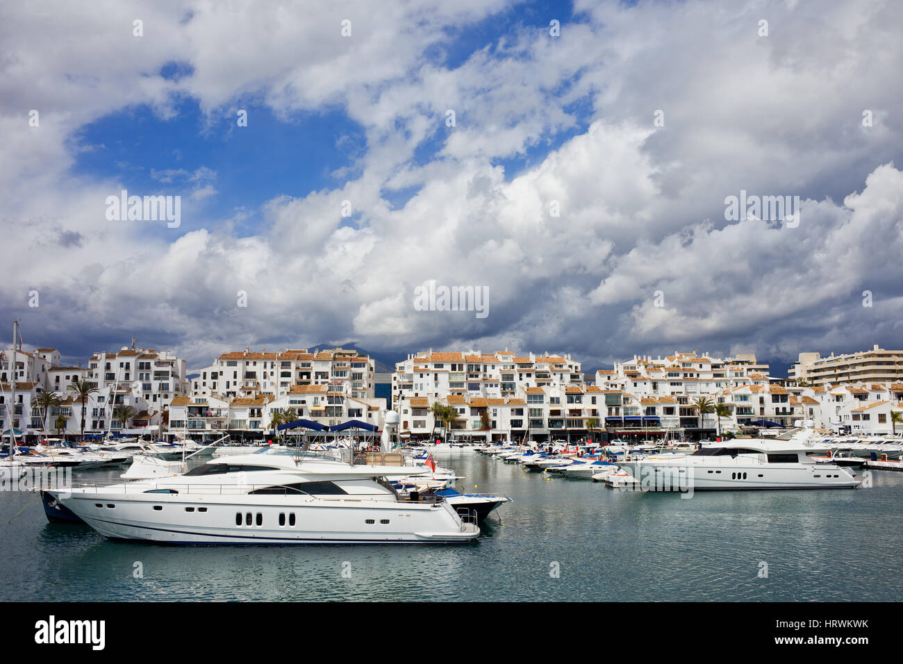 Motor launch/boat moored in Puerto Banus marina near Marbella Costa del Sol  Spain with white apartments in background Stock Photo - Alamy