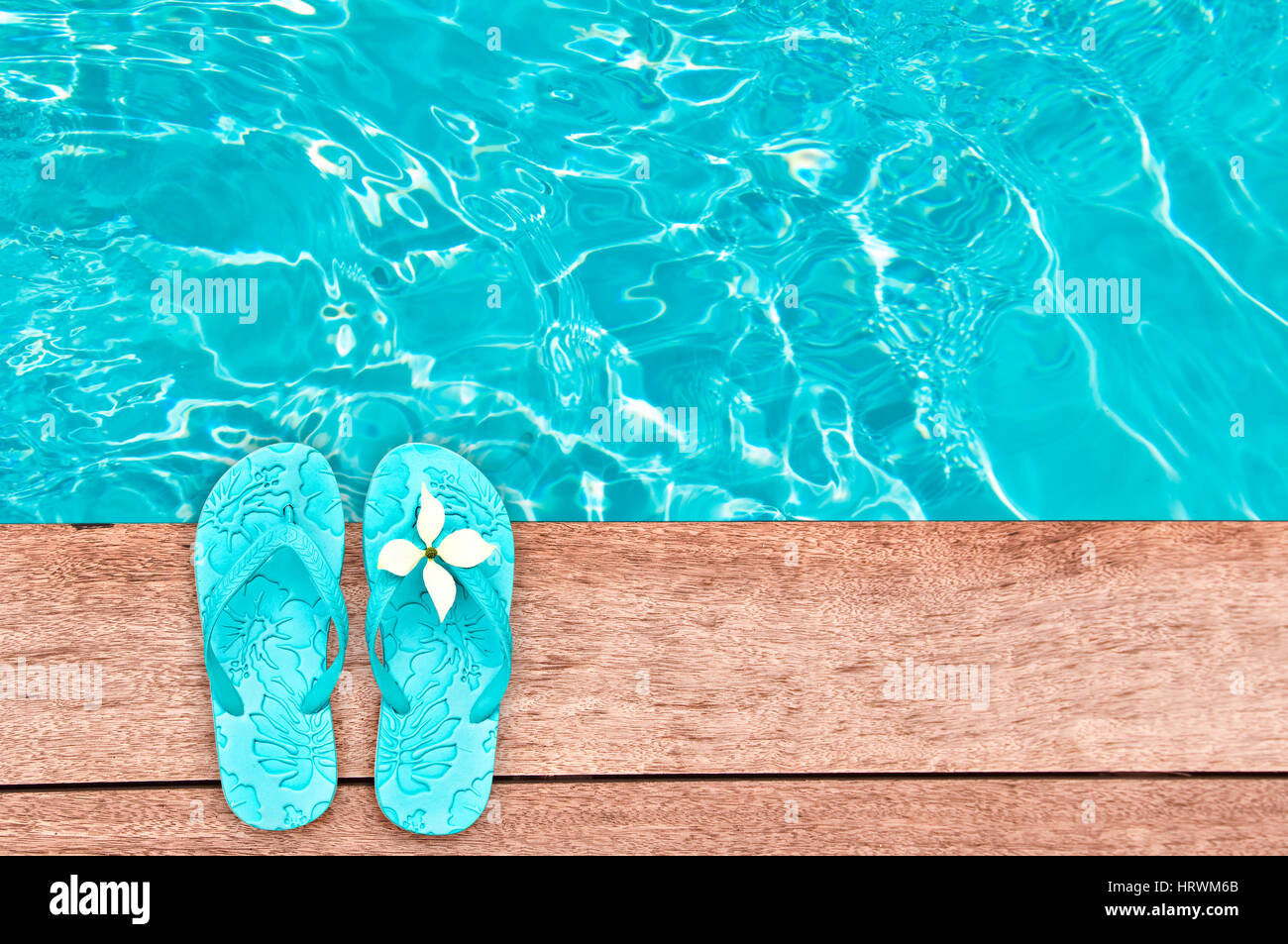 Sandals by a swimming pool, summer concept Stock Photo - Alamy