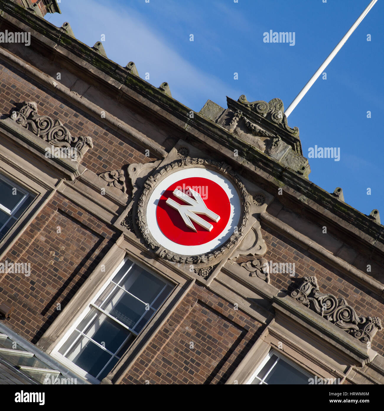 The British Rail Double Arrows or Arrows of Indecision Railway logo still used by Network Rail and universally understood to mean Railway Station Stock Photo