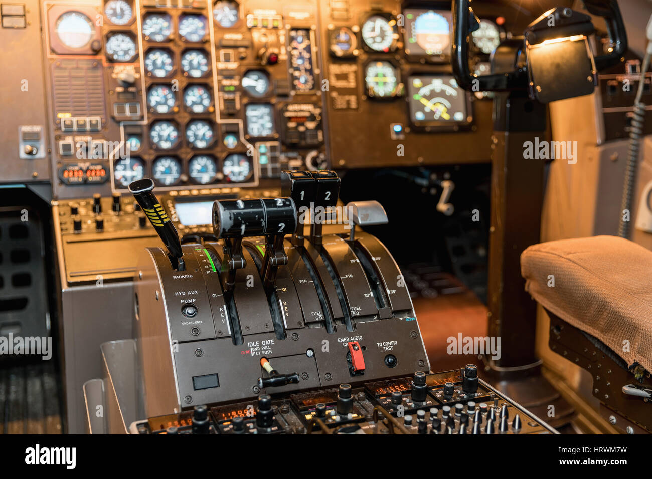 Airplan control stick in side pilot cockpit. Engine lever in the cockpit of an airliner. Center console and throttles in an airplane Stock Photo
