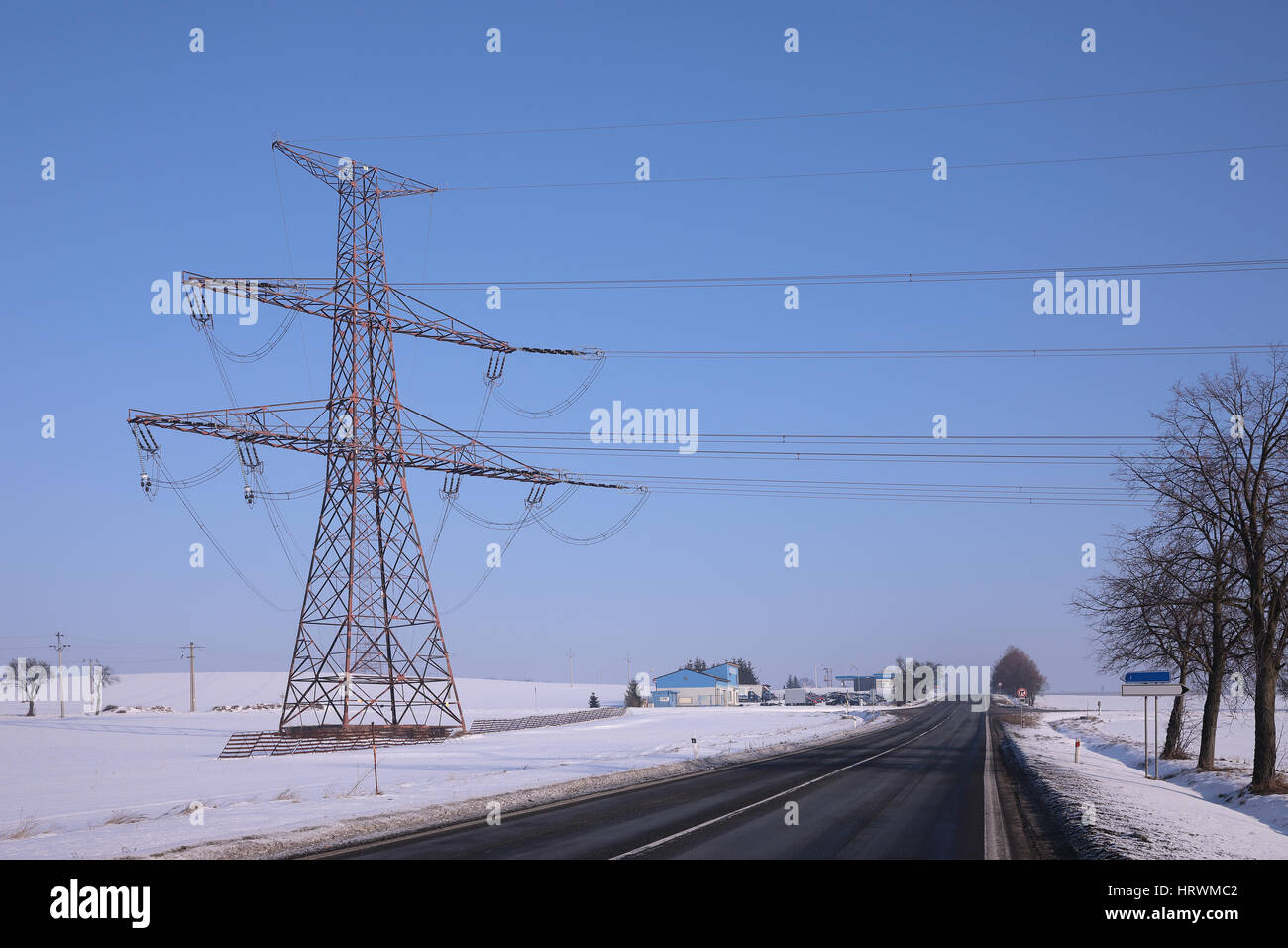 high voltage pylons in winter on a sunny day Stock Photo - Alamy