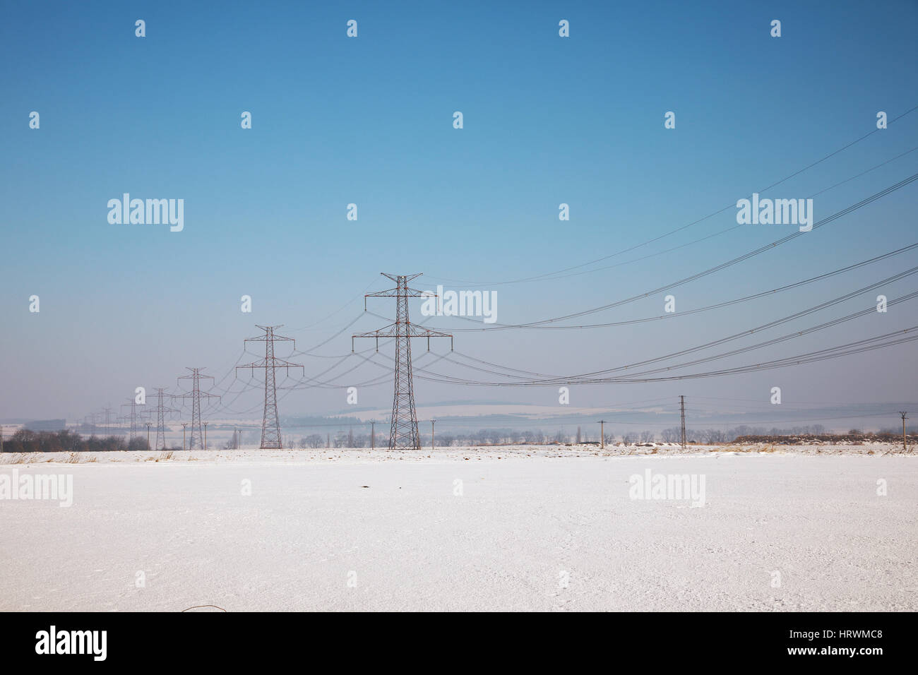 high voltage pylons in winter on a sunny day Stock Photo - Alamy