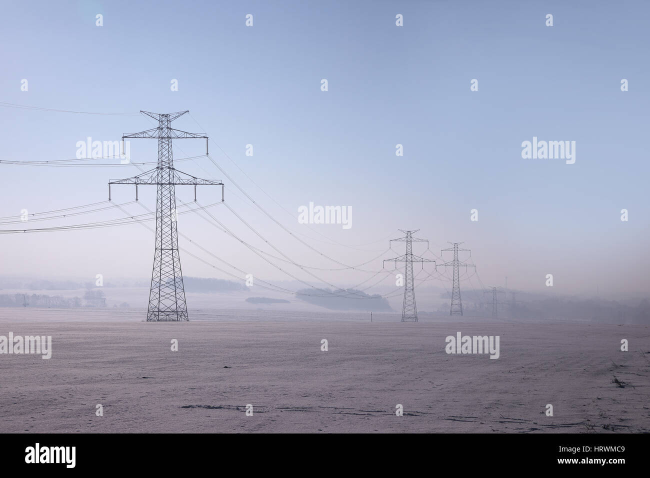 high voltage pylons in winter on a sunny day Stock Photo - Alamy