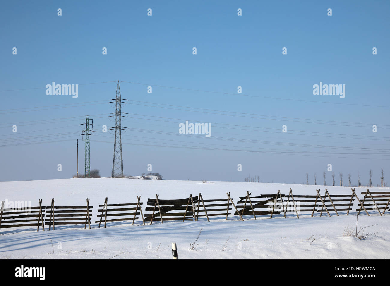 high voltage pylons in winter on a sunny day Stock Photo - Alamy