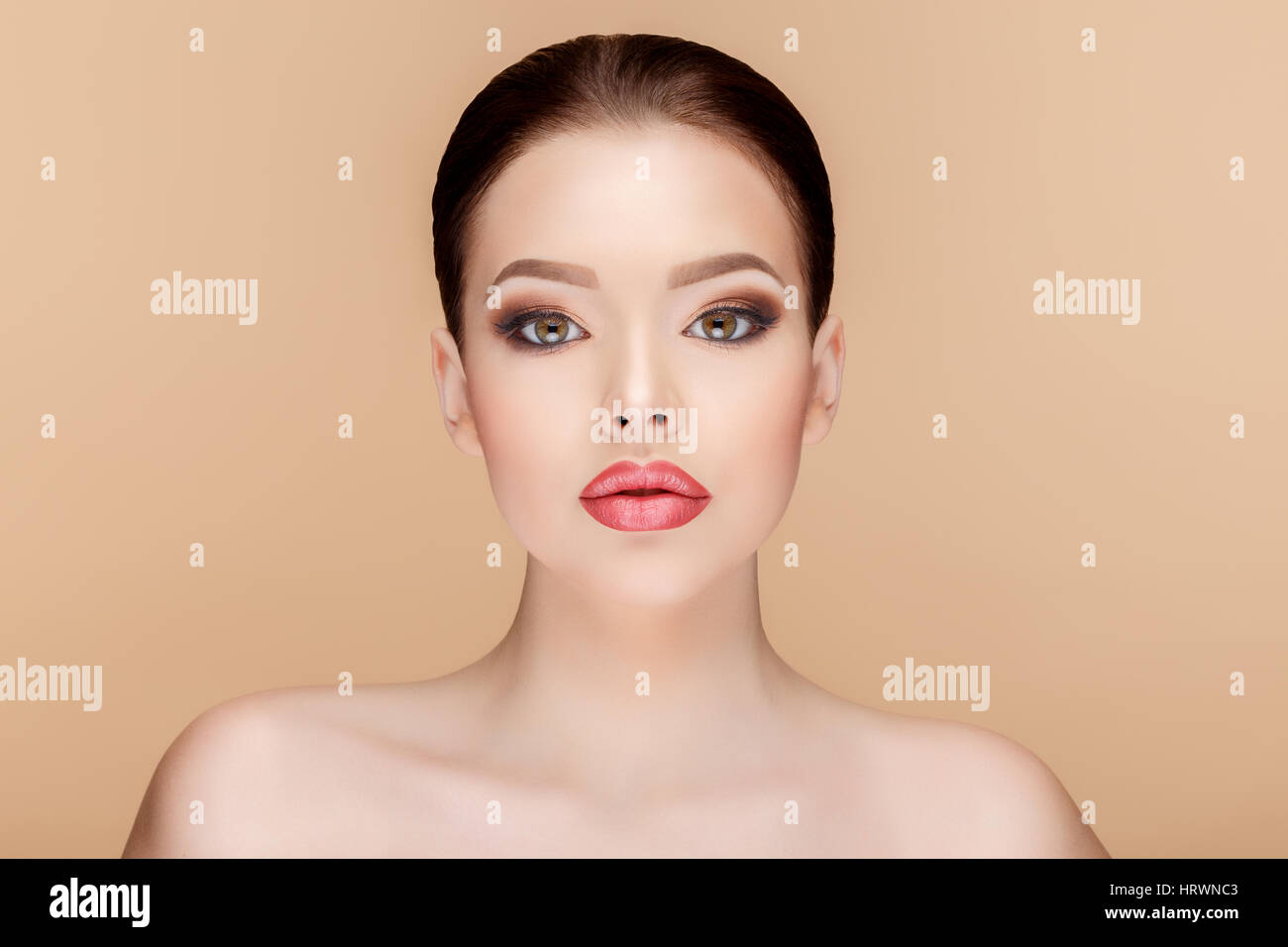 Beautiful Face of Young Woman with Clean Fresh Skin close up on beige ...