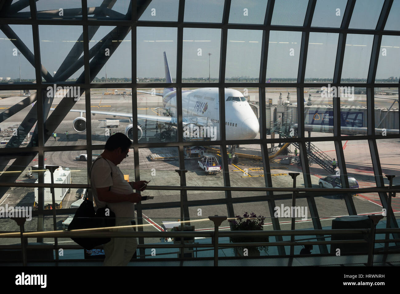 25.01.2017, Bangkok, Thailand, Asia - A Thai Airways passenger plane is parked at a gate at Bangkok's Suvarnabhumi Airport. Stock Photo