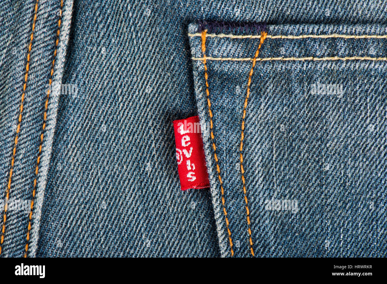 BANGKOK, THAILAND - DECEMBER 09 2014: Close up of the LEVI'S red label on the back pocket of denim jeans. LEVI'S is a brand name of Levi Strauss and Co, founded in 1853. Stock Photo