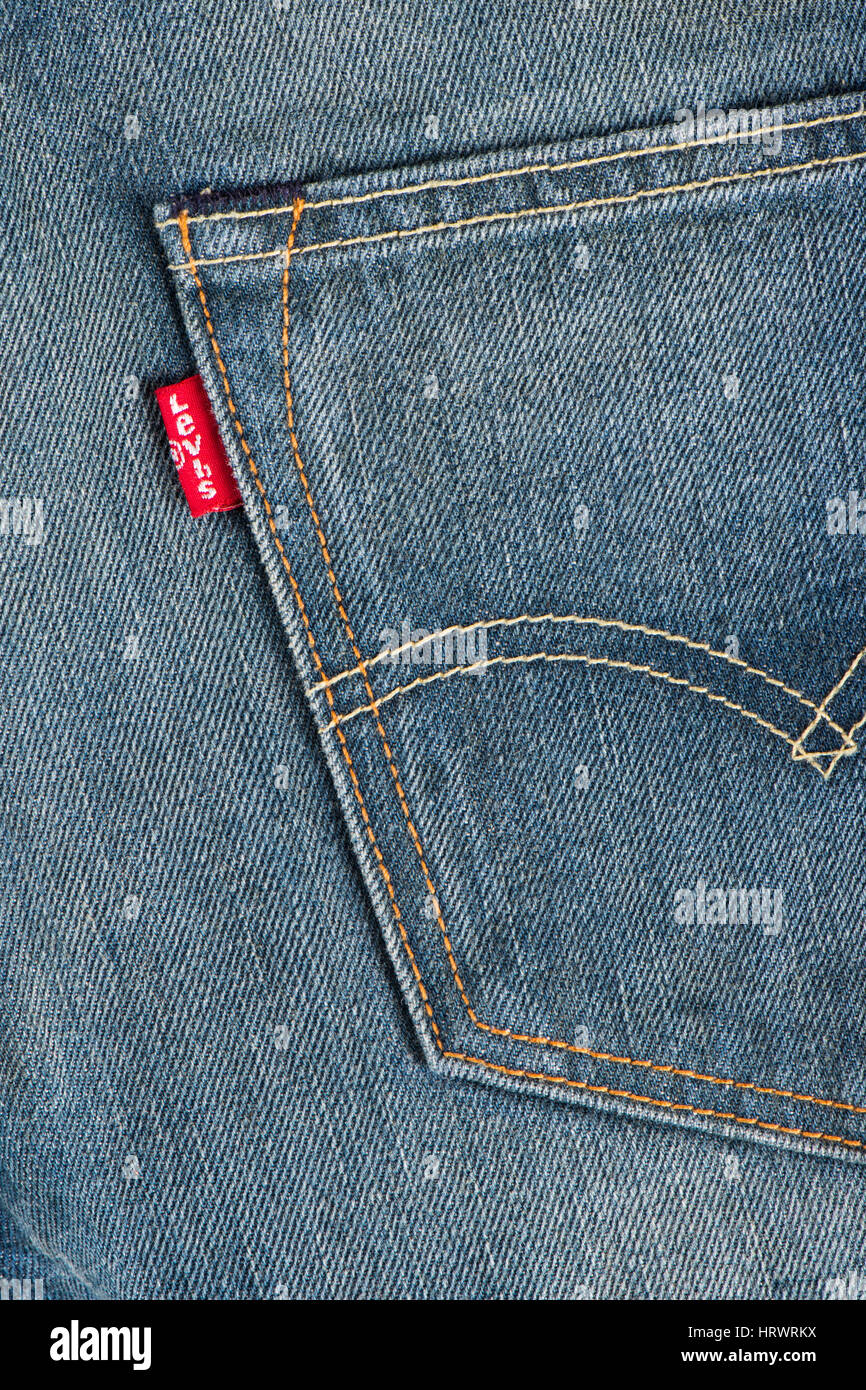 BANGKOK, THAILAND - DECEMBER 09 2014: Close up of the LEVI'S red label on the back pocket of denim jeans. LEVI'S is a brand name of Levi Strauss and Co, founded in 1853. Stock Photo