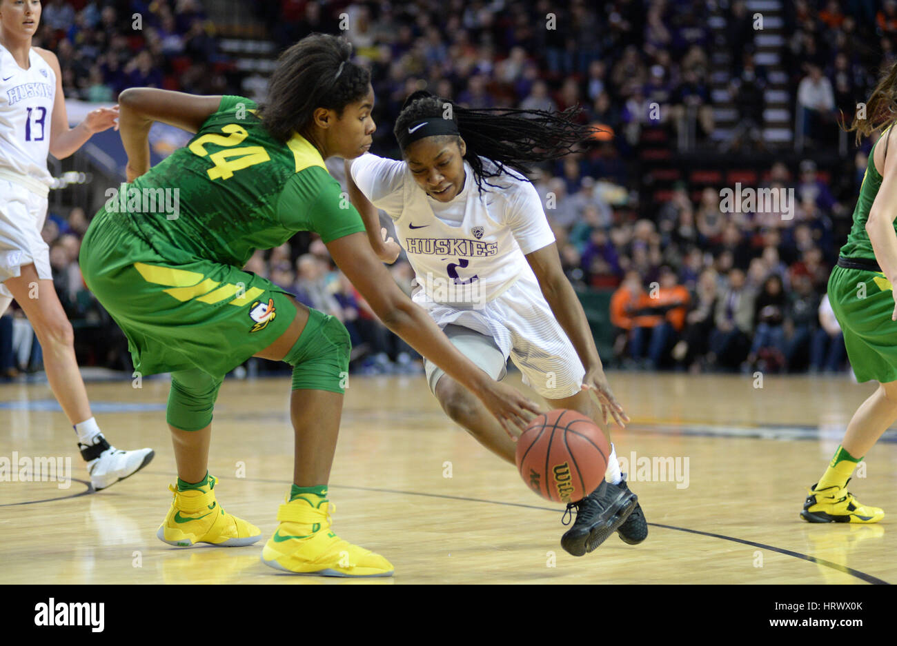 March 3, 2017: UW point guard Aarion McDonald (2) drives to the hoop against Oregon's Ruthy Hebard (24) during a PAC12 women's tournament game between the Washington Huskies and the Oregon Ducks. The game was played at Key Arena in Seattle, WA. Jeff Halstead / CSM Stock Photo