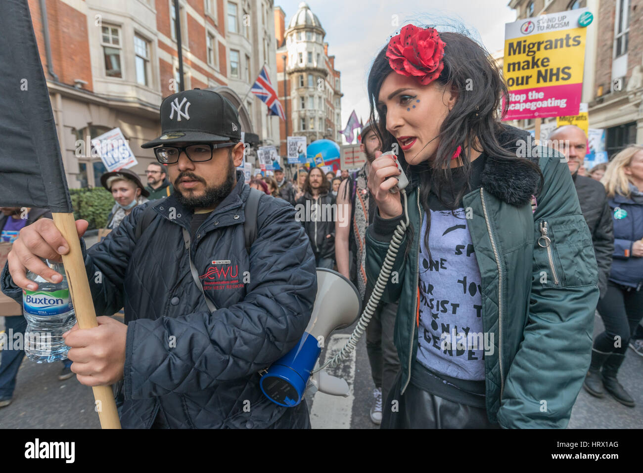 London, UK. 4th March 2017. A singer on the  march though London from Tavistock Square where the BMA have their headquarters to a rally in Parliament Square in protest against the cuts and privatisation of the NHS which they say is at breaking point. At the rally before the march, local councils who had turned down the Sustainability and Transformation Plans for hospital closures and cuts in services were loudly cheered and others were urged to follow their example. Credit: Peter Marshall/Alamy Live News Stock Photo