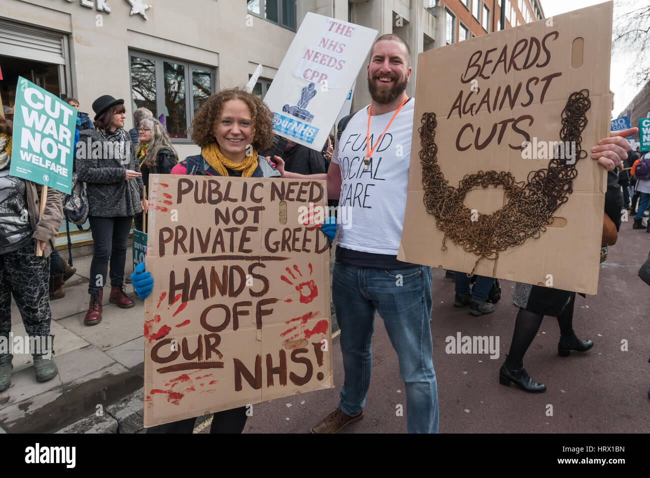 London, UK. 4th March 2017. 'Beards Against Cuts' were among the many thousands march though London from Tavistock Square where the BMA have their headquarters to a rally in Parliament Square in protest against the cuts and privatisation of the NHS which they say is at breaking point. At the rally before the march, local councils who had turned down the Sustainability and Transformation Plans for hospital closures and cuts in services were loudly cheered and others were urged to follow their example. Credit: Peter Marshall/Alamy Live News Stock Photo