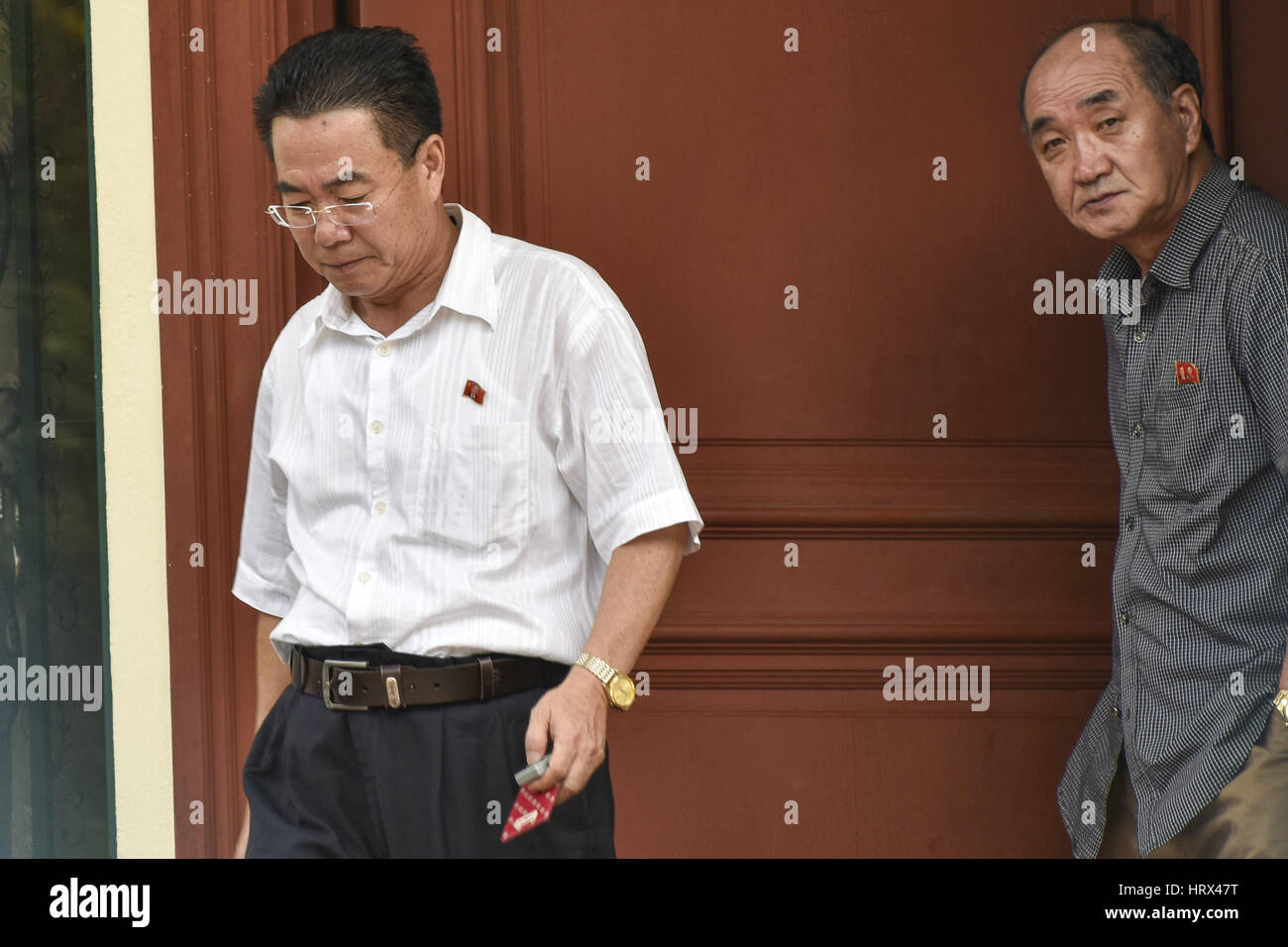 Kuala Lumpur, MALAYSIA. 5th Mar, 2017. North Korean Embassy counsellor Kim Yu Song(L) and unidentify man(R) step out from the North Korea Embassy in Kuala Lumpur, Malaysia on March 05, 2017 at Kuala Lumpur, Malaysia. North Korean Ambassador Kang Chol has accused Malaysia of colluding with foreign powers in the murder of Kim Jong-nam, must leave the country within 48 hours. Credit: Chris Jung/ZUMA Wire/Alamy Live News Stock Photo