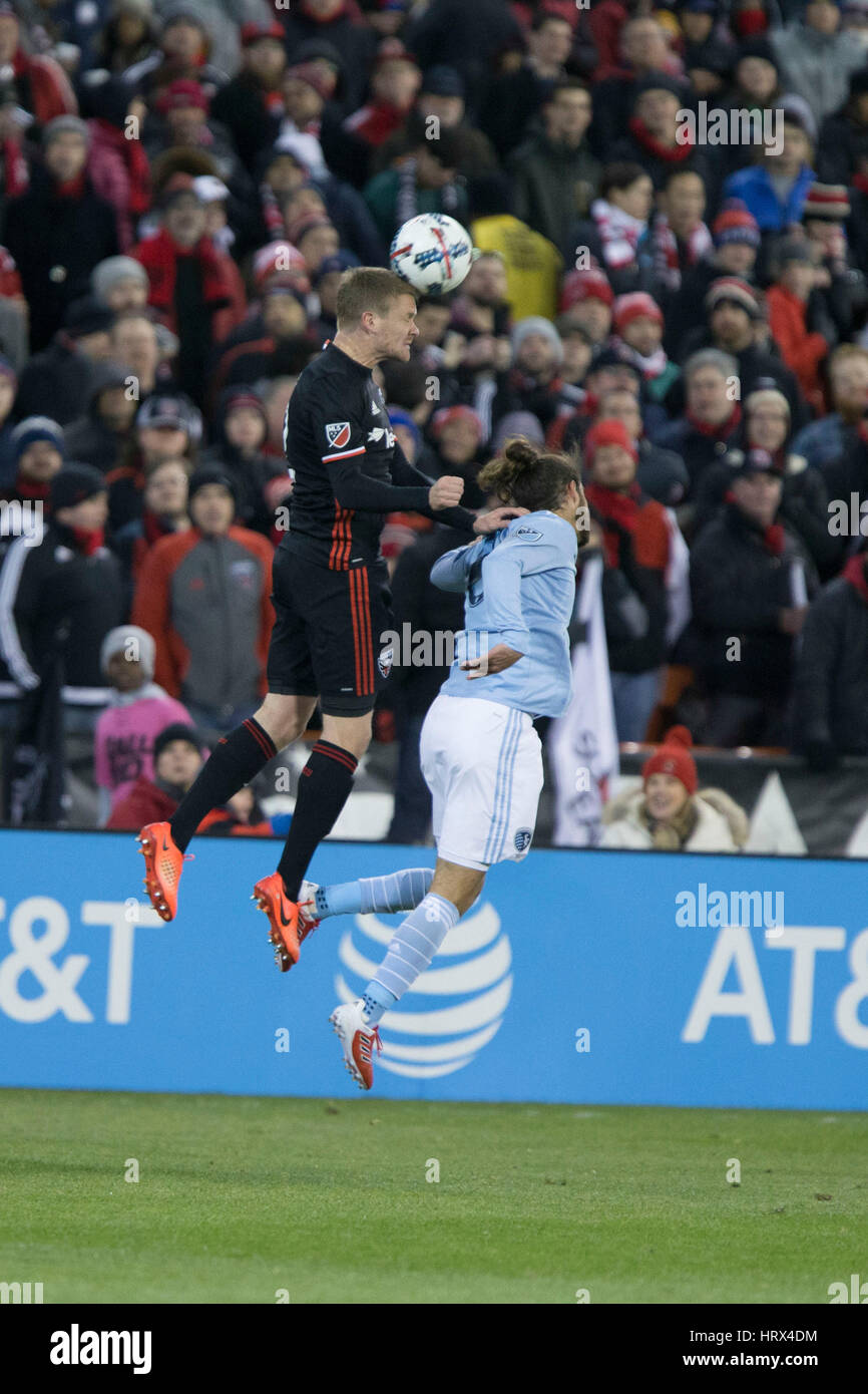 Washington, DC, USA. 04th Mar, 2017. D.C. United defender Taylor Kemp (2) battles Sporting Kansas City midfielder Graham Zusi (8) for a 50-50 ball during D.C. United's home opener against Sporting Kansas City which finished 0-0 at RFK Stadium in Washingto Stock Photo