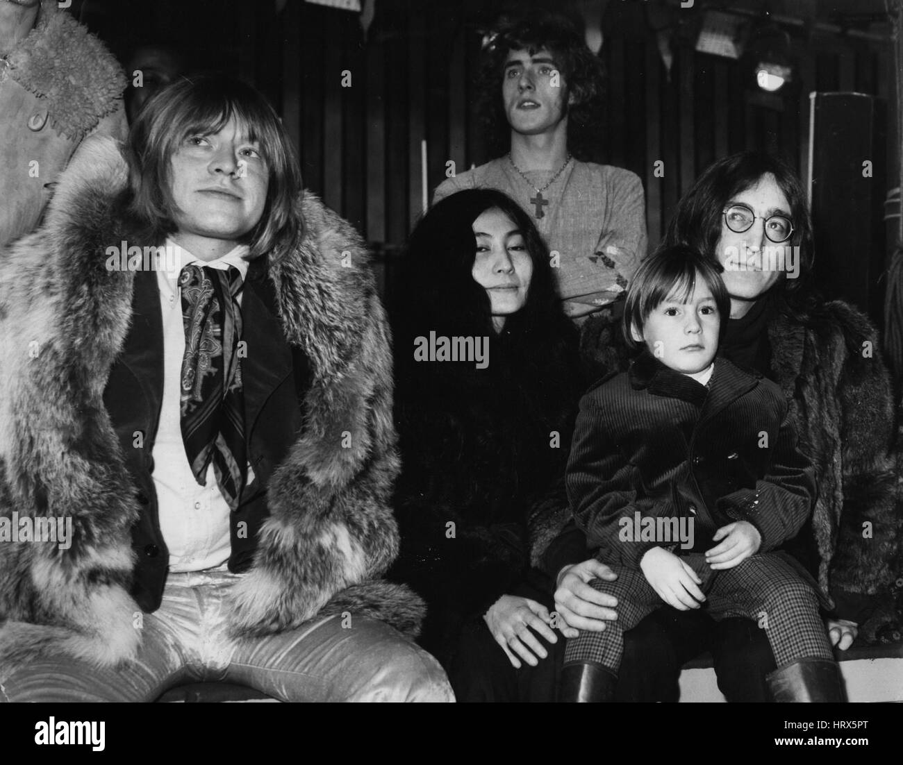 Jun. 06, 1970 - 'Stones' Circus for T.V.: The World's most contrversial pop group, 'The Rolling Stones' are to produce their own television spectacular, tentatively titled ''Rolling Stones' Rock 'n' Roll Circus Shows. The show, which will be televised early nest year, will feature the Rolling Stones, many top popstars - and clowns, animals and dwarfs from Sir Robert Fossett's Circus. The show is being filmed at Internet Studios, Wembly. Watching circus acts as the Intertel Studios - (L. to R.) Brian Jones, of the Rolling Stones, Yoko Ono, and John Lennon, with his son Julian. (Credit Image: © Stock Photo