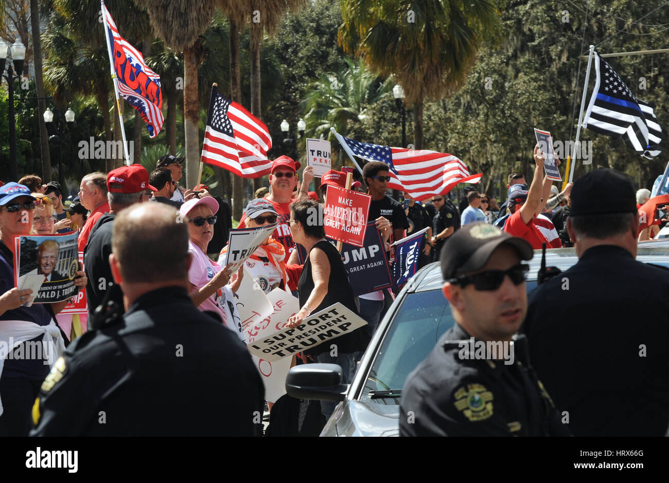 Orlando, Florida, USA. March 4, 2017. Supporters of U.S. President Donald Trump hold a rally and march at Lake Eola park in downtown Orlando, Florida on March 4, 2017. Anti-Trump protesters held a counter march across the street, causing verbal clashes between the two groups. Credit: Paul Hennessy/Alamy Live News Stock Photo