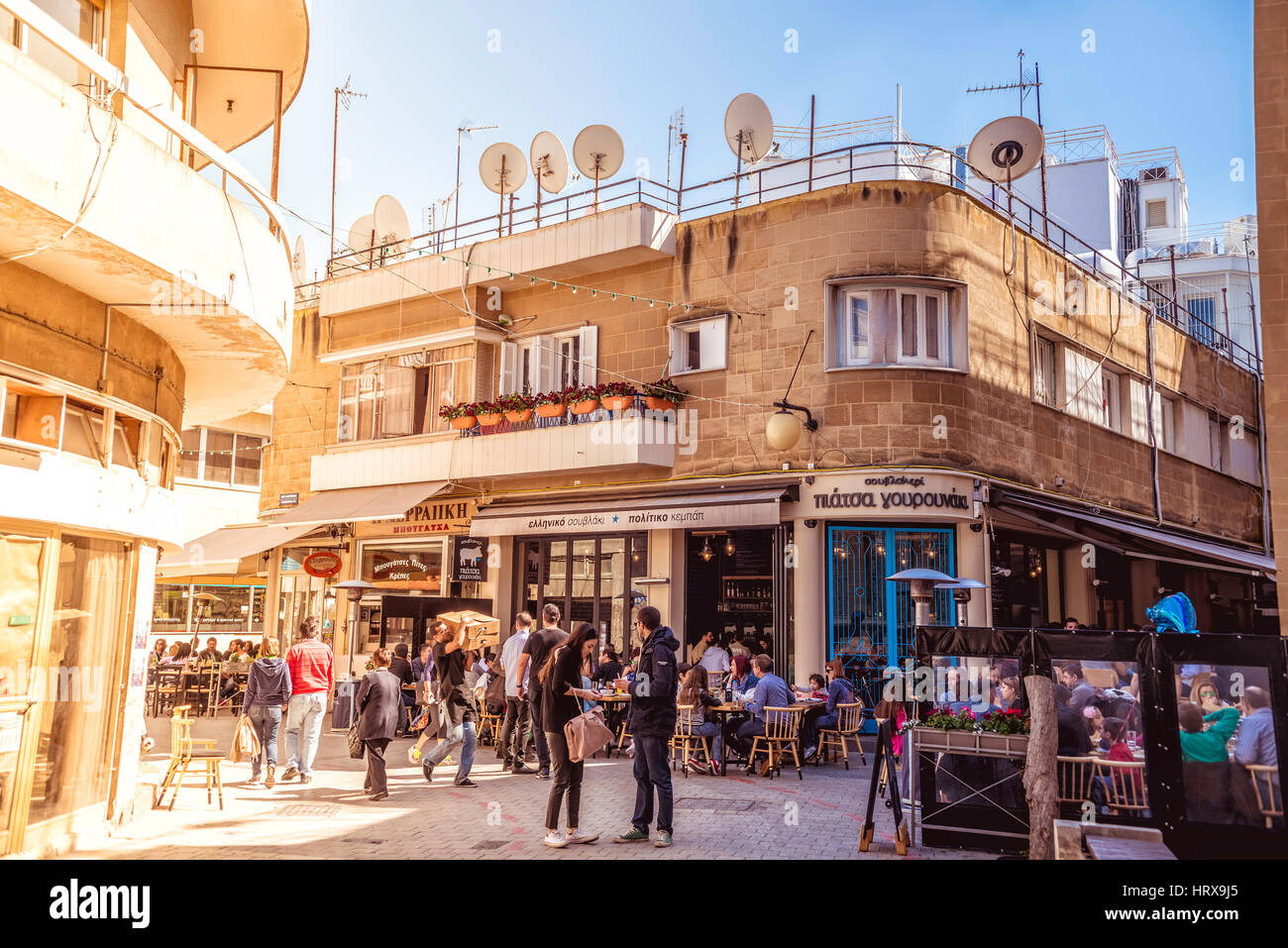 NICOSIA - APRIL 13 : People in restaurants and traditional coffee shops at Ledra street on April 13, 2015 in Nicosia, Cyprus. Ledra, main street of th Stock Photo