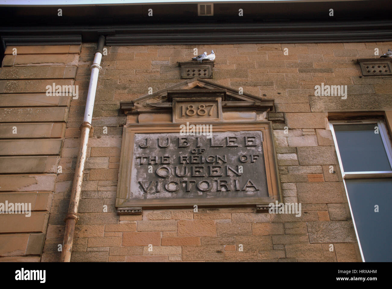 queen Victoria jubilee sign olf victorian  school sandstone sign Stock Photo