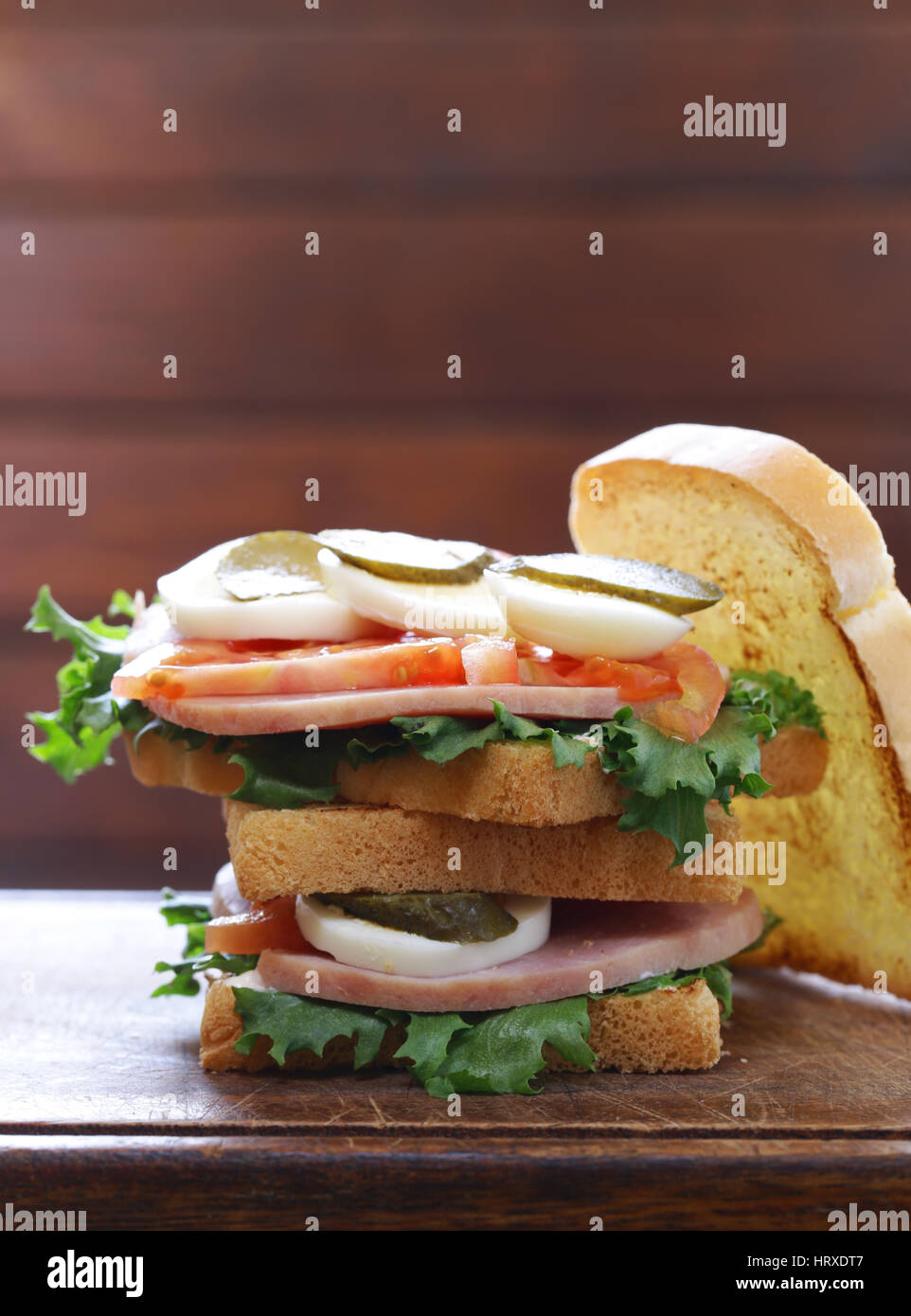 Samich sandwich with ham, tomato, egg and pickles Stock Photo - Alamy
