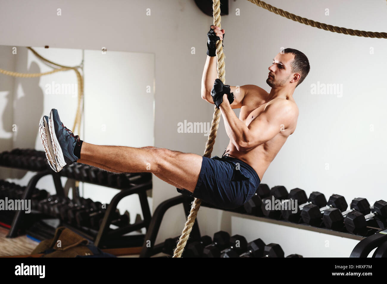rope climbing workout athlete man in gym Stock Photo Alamy