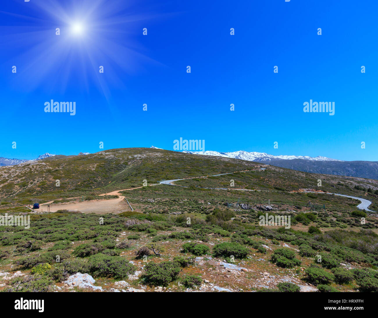 Summer mountain sunshiny landscape with alpine road (Sierra Nevada