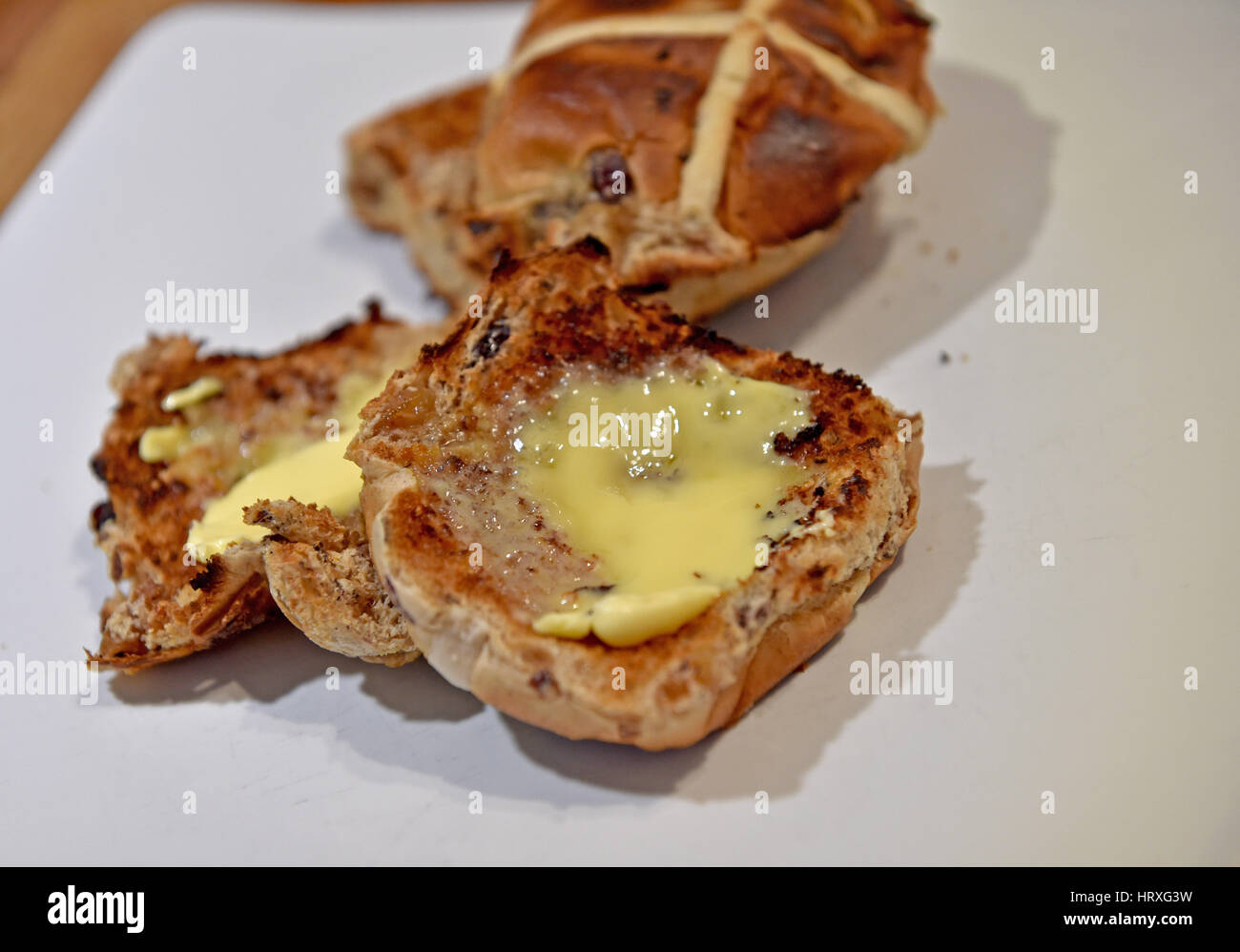 Toasted hot cross buns with butter for Easter Good Friday celebrations