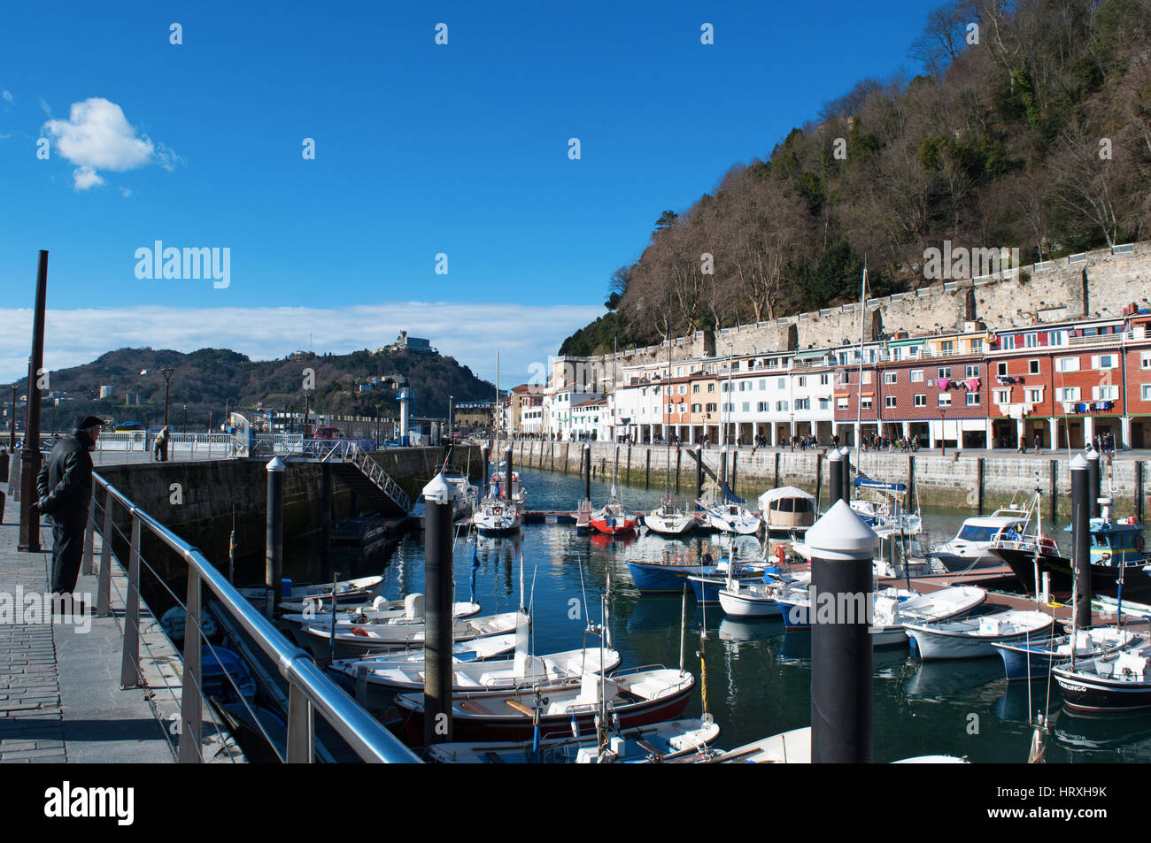 Spain boats in the port and view of the skyline on the seafront of Donostia San Sebastian, the