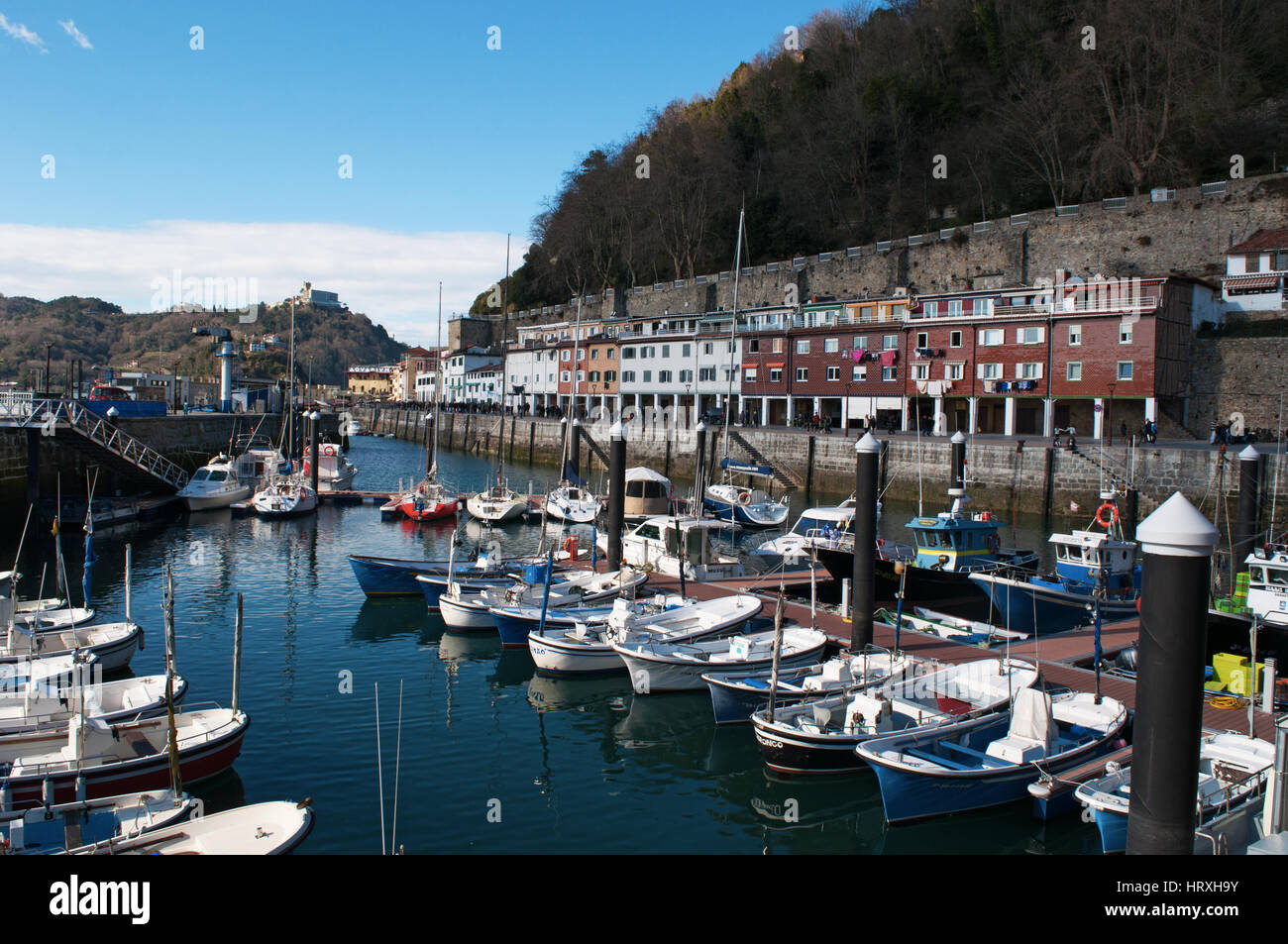Spain boats in the port and view of the skyline on the seafront of Donostia San Sebastian, the
