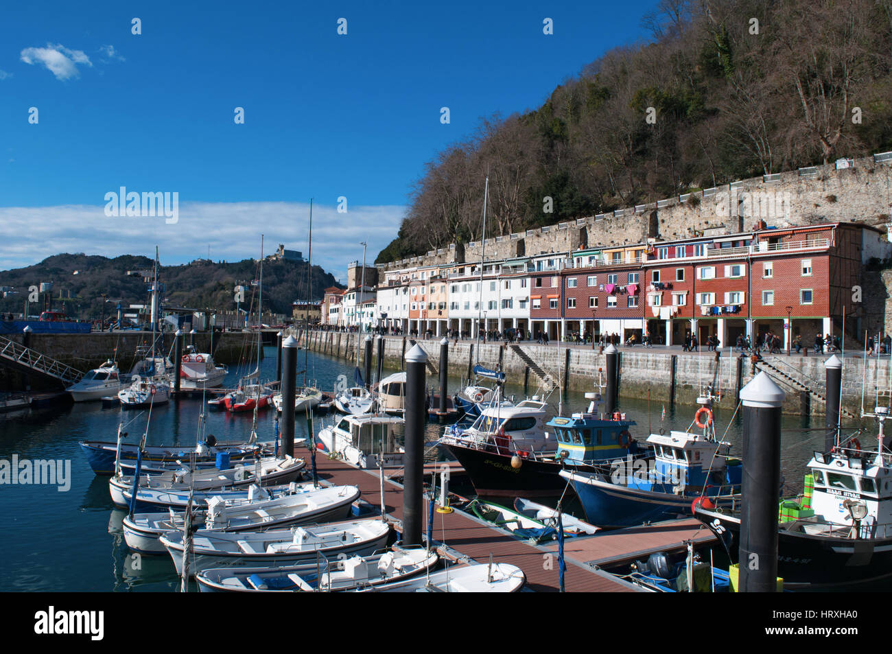 Spain boats in the port and view of the skyline on the seafront of Donostia San Sebastian, the