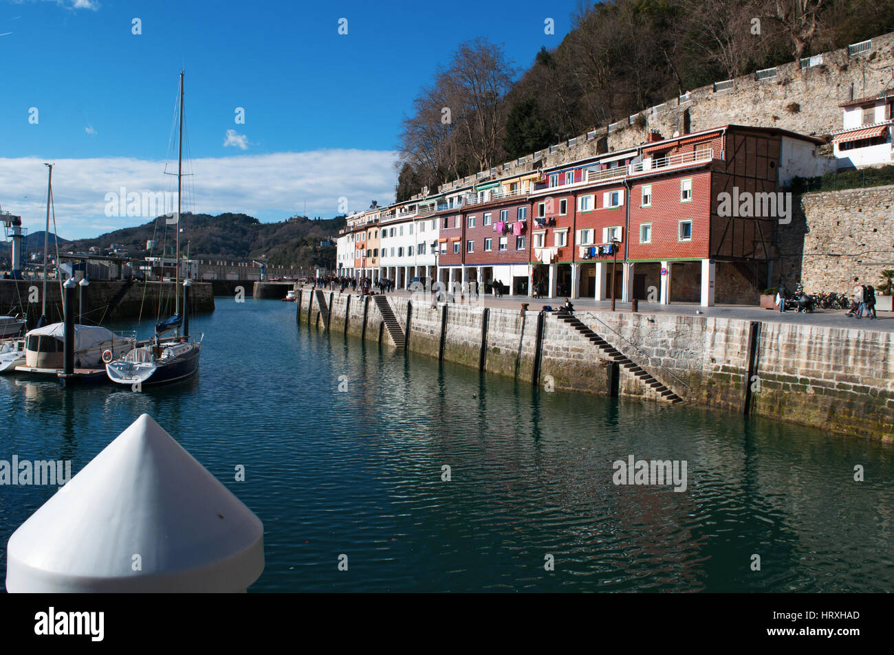 Basque Country boats in the port and view of the skyline on the seafront of Donostia San